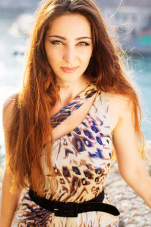 Beautiful woman in sunset lightsの写真素材