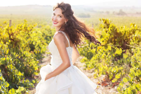 Bride in a vineyard, autumnの写真素材