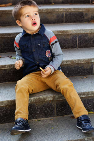 Little toddler boy in autumn parkの写真素材