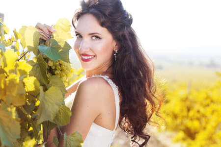 Bride in a vineyard, autumnの写真素材