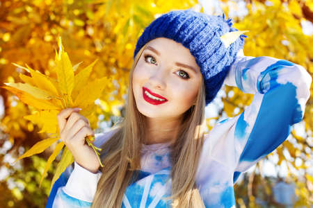 Autumn woman happy with colorful fall leavesの写真素材