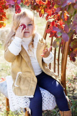 Adorable little girl is wearing winter clothesの写真素材
