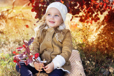 Adorable little girl is wearing winter clothesの写真素材