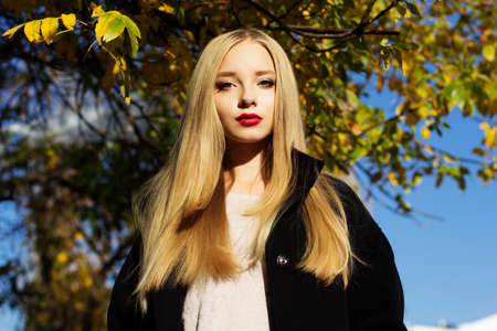 Pretty girl is wearing winter black coat