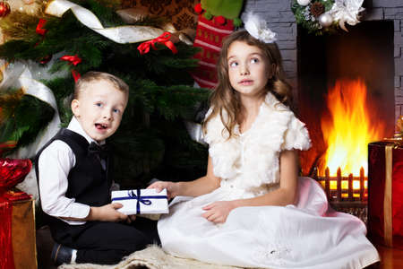 Happy children with christmas presentsの写真素材