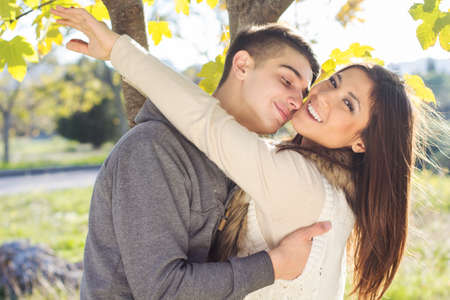 Young happy couple in the  park