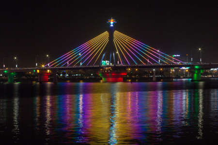 Han River Bridge in Danang, Vietnam. The Han River Bridge in Danang is a cable-stayed bridge that is lit up brightly at night.の写真素材