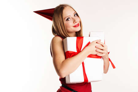 Beautiful girl holding white gift boxes