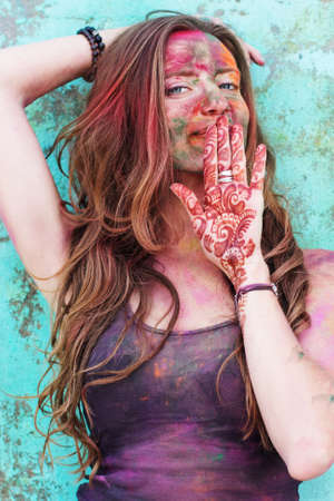 Portrait of an emotional girl with paint on her face, India, Holi festival, Rishikeshの写真素材