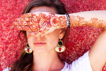 Mehendi art or Heena Tattoo on the hand of beautiful girl, Indiaの写真素材