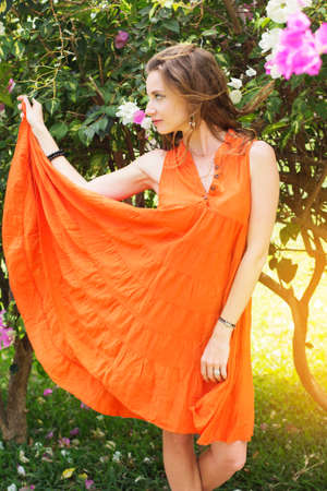 Pretty woman in park with flowers, India Goaの写真素材