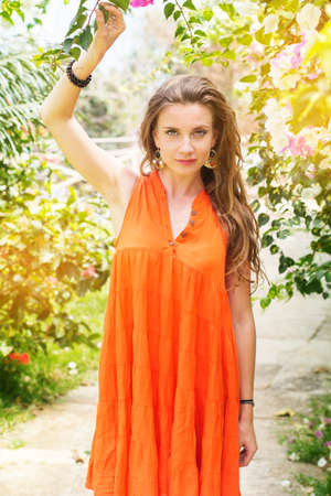 Pretty woman in park with flowers, India Goaの写真素材