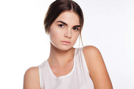 Teen girl with perfect skin and nude makeup on her faceの写真素材