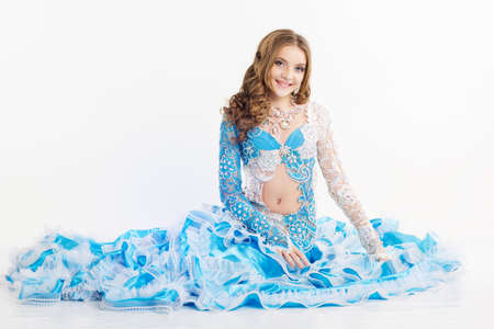 Beautiful young girl is wearing blue belly-dancer dressの写真素材