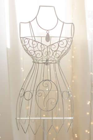 White vintage metallic hanger with wire dress formの写真素材