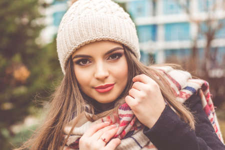 Pretty teen girl is wearing warm winter clothesの写真素材