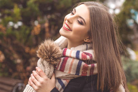 Pretty teen girl is wearing warm winter clothesの写真素材