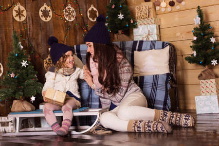 Mother and daughter wearing warm winter clother