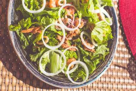 Seafood salad on the table near seaの写真素材