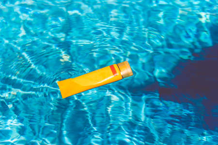 Sunscreen lotion in swimming poolの写真素材