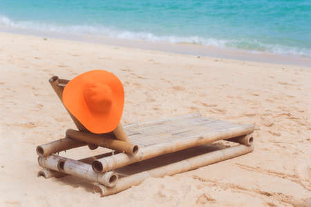 Deck chair on the beach with hatの写真素材