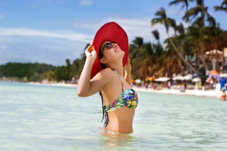 Happy woman in summer vacation at the oceanの写真素材
