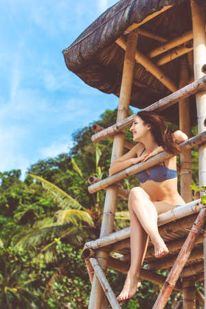Happy woman in summer vacation at the beachの写真素材