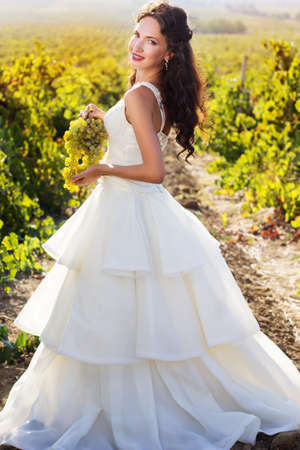 Fashion bride is walking in a vineyard wedding time.の写真素材