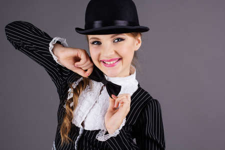Beautiful dancer wearing black gentleman costumeの写真素材