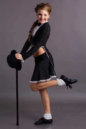 Beautiful dancer wearing black gentleman costumeの写真素材