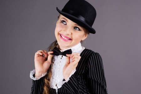 Beautiful dancer wearing black gentleman costumeの写真素材