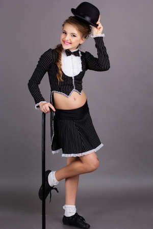 Beautiful dancer wearing black gentleman costumeの写真素材