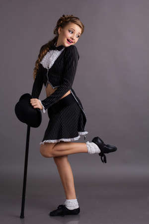 Beautiful dancer wearing black gentleman costumeの写真素材