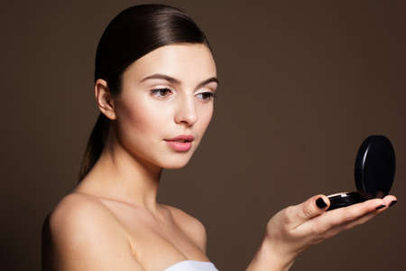 Portrait of a naturally beautiful woman with good foundation that makes skin flawless and perfectの写真素材