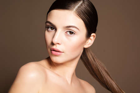 Portrait of a naturally beautiful girl with flawless perfect skinの写真素材