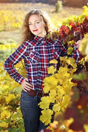 Grape goddess. Beautiful young lady in colorful grape fieldの写真素材