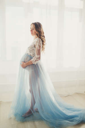 Pregnant pretty girl is wearing fashion lingerieの写真素材