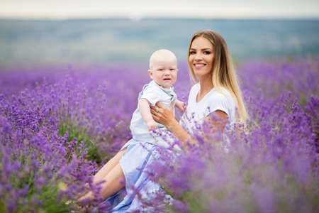 Happy mother and her little son posing in a lavender fieldの写真素材