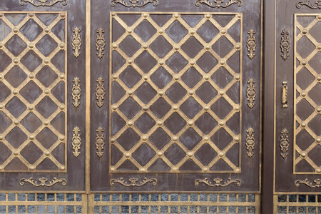 Metal gates. Element forged fence. Part of the vintage wrought iron gate. Background, texture of metal gates.の写真素材