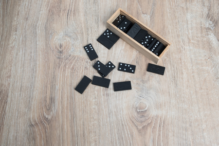 Domino game. Dominoes on a wooden table.の写真素材