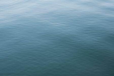 Abstract background of blue water, sea. Blurred background. Rippled water texture. Abstract background of the sea surface.の写真素材