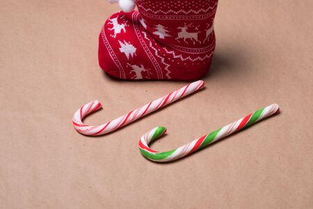 Christmas card. Christmas sock and caramel candies. Candy cane.の写真素材