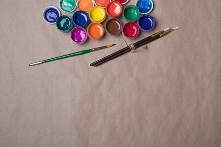 Set of paints for painting with brushes. Acrylic paints in tubes. Old paint in bottles. Paint brushes for painting.の写真素材