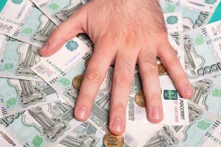 Man holds Russian money. Financial theme. Money in men's hands.の写真素材