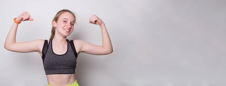 Young beautiful sporty girl doing sport wearing sportswear. Banner with blank space for text.