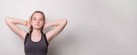 Sad beautiful sporty girl doing sport wearing sportswear. Banner with blank space for text.の写真素材