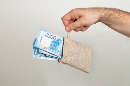 Bag with Russian money, banknotes. Russian rubles in a fabric bag.