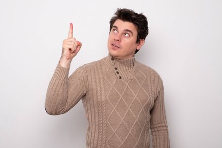 Handsome man pointing at empty space.の写真素材