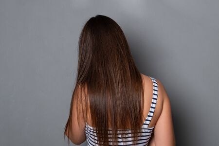 Woman with beautiful dark hair.の写真素材