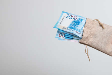 Bag with Russian money, banknotes. Russian rubles in a fabric bag.